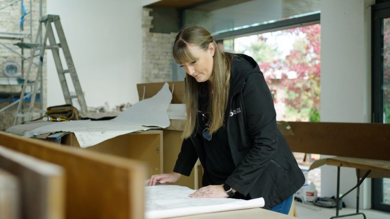 Lead designer Sarah Gallop working on drawings for a current project.