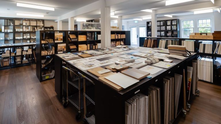 A full table covered in samples for home design.